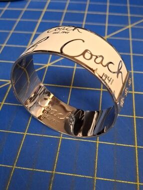 Coach White and Silver Script Cuff Bracelet New